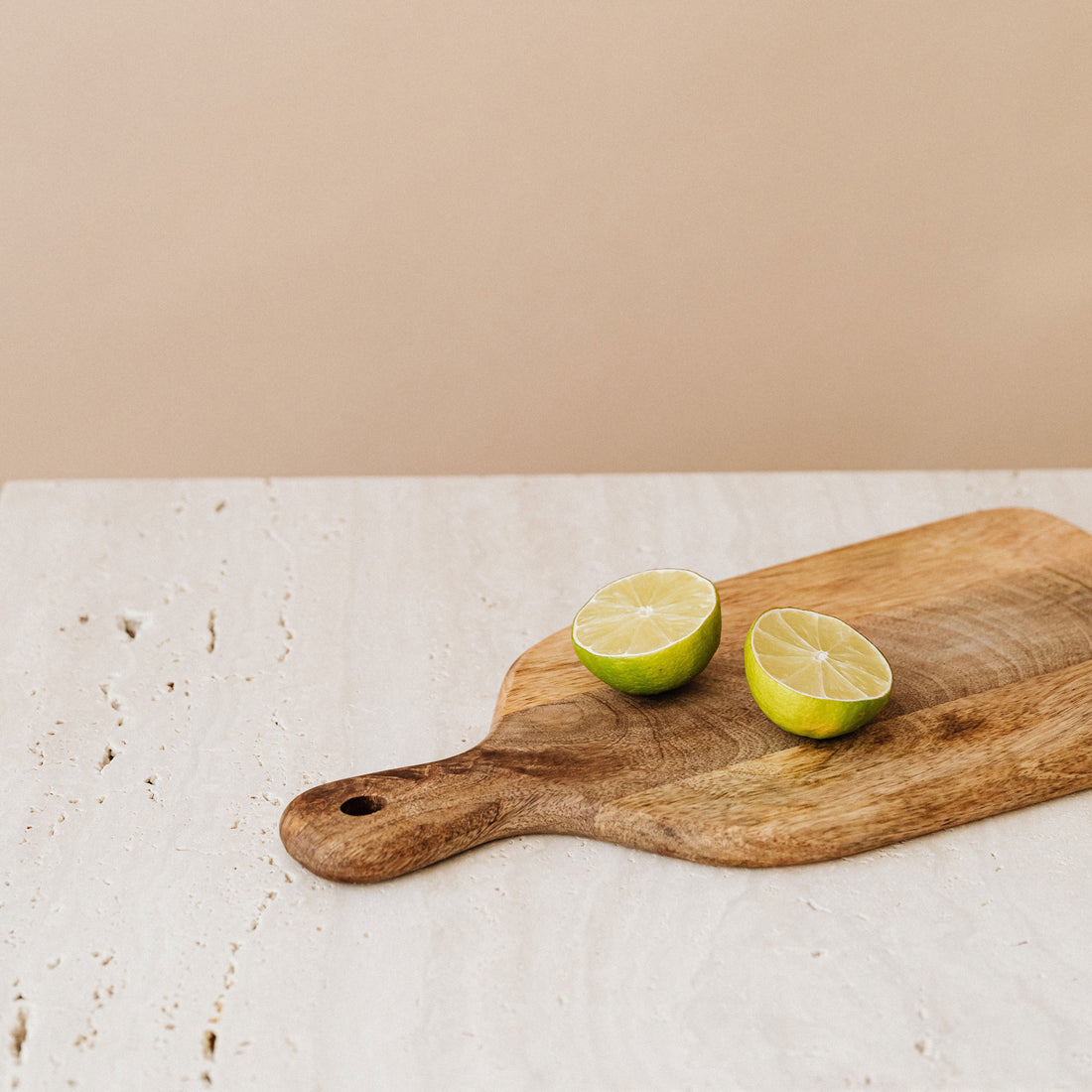 Cleaning a cutting board with lemon and salt